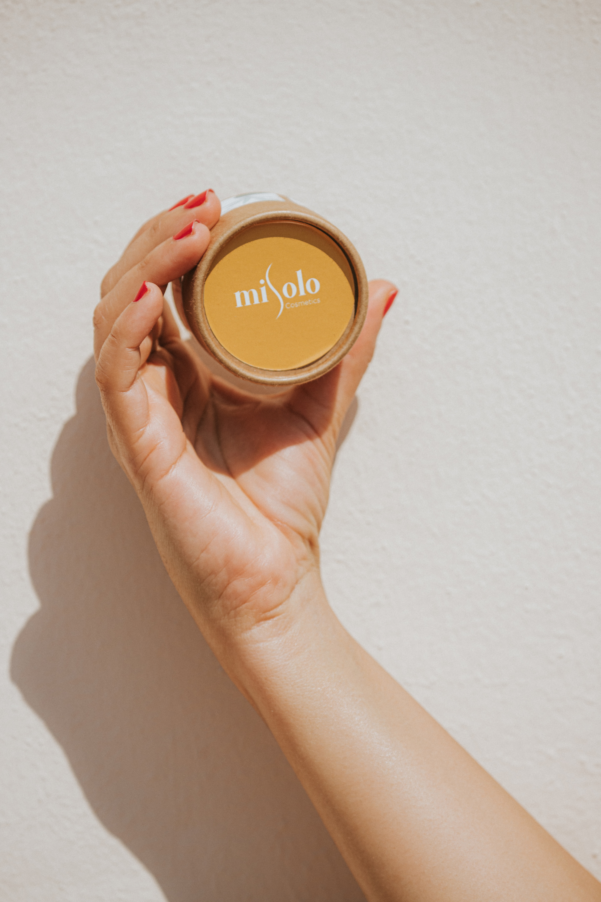 Close-Up Shot of a Person Holding a Skin Care Product