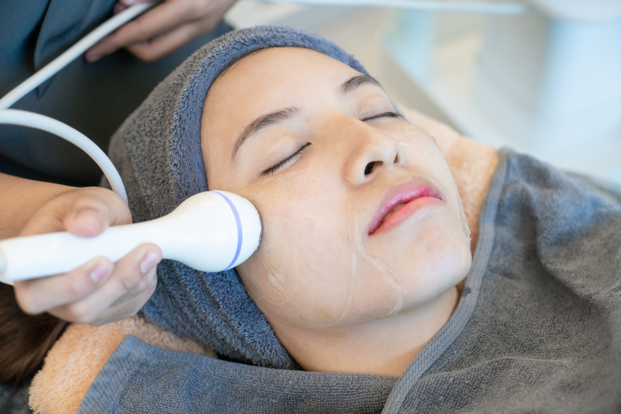 Young Woman Getting Facial Treatment  
